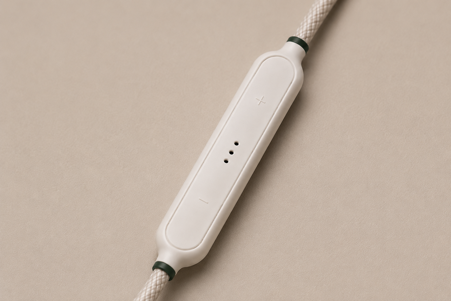 White inline microphone with a braided cable on a beige background